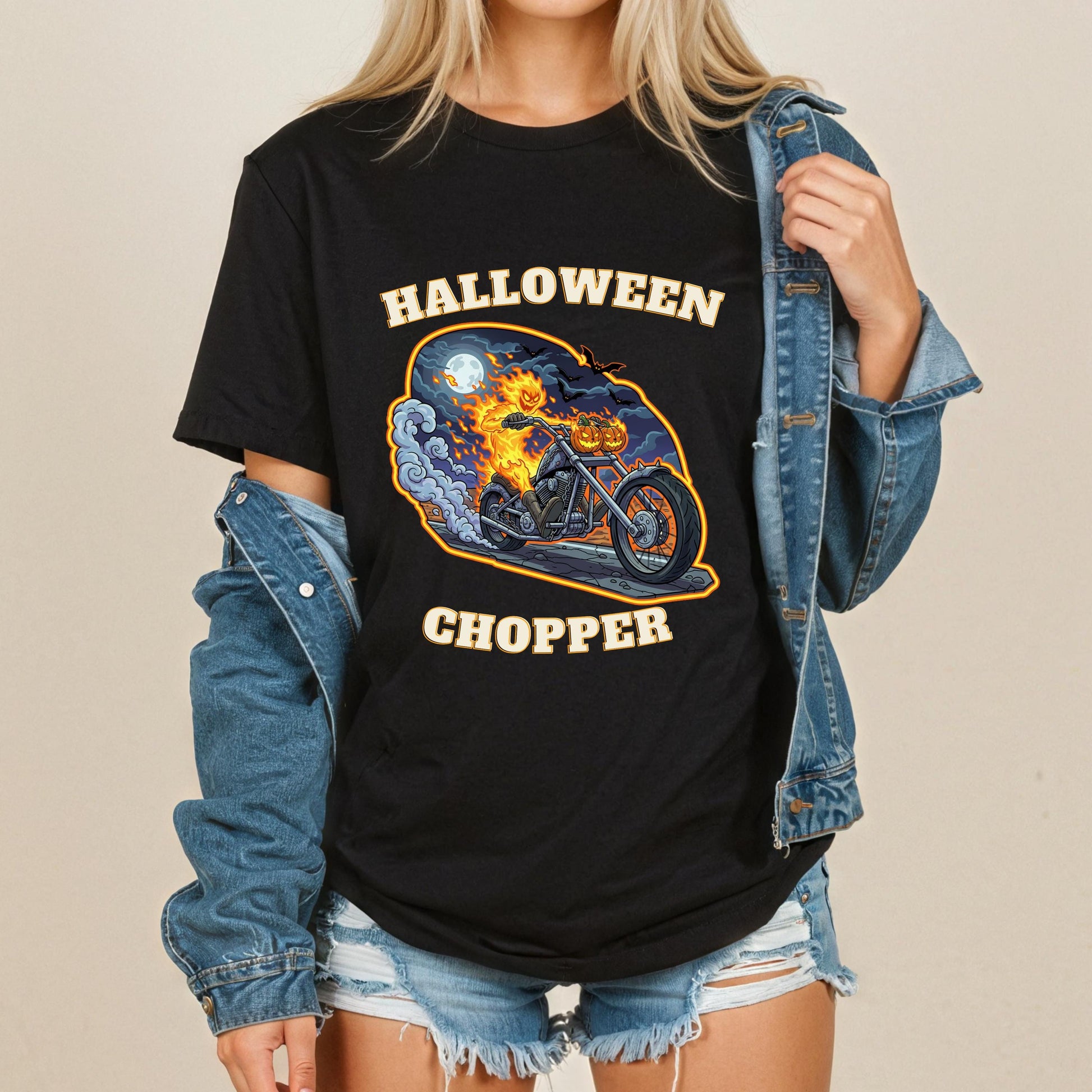 A woman wearing a black t-shirt with a graphic design of a motorcycle and a jack-o-lantern, along with the text "HALLOWEEN CHOPPER".