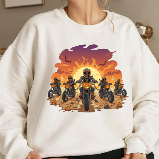 A white sweatshirt with a graphic design depicting a group of skeletons riding motorcycles against a sunset background.