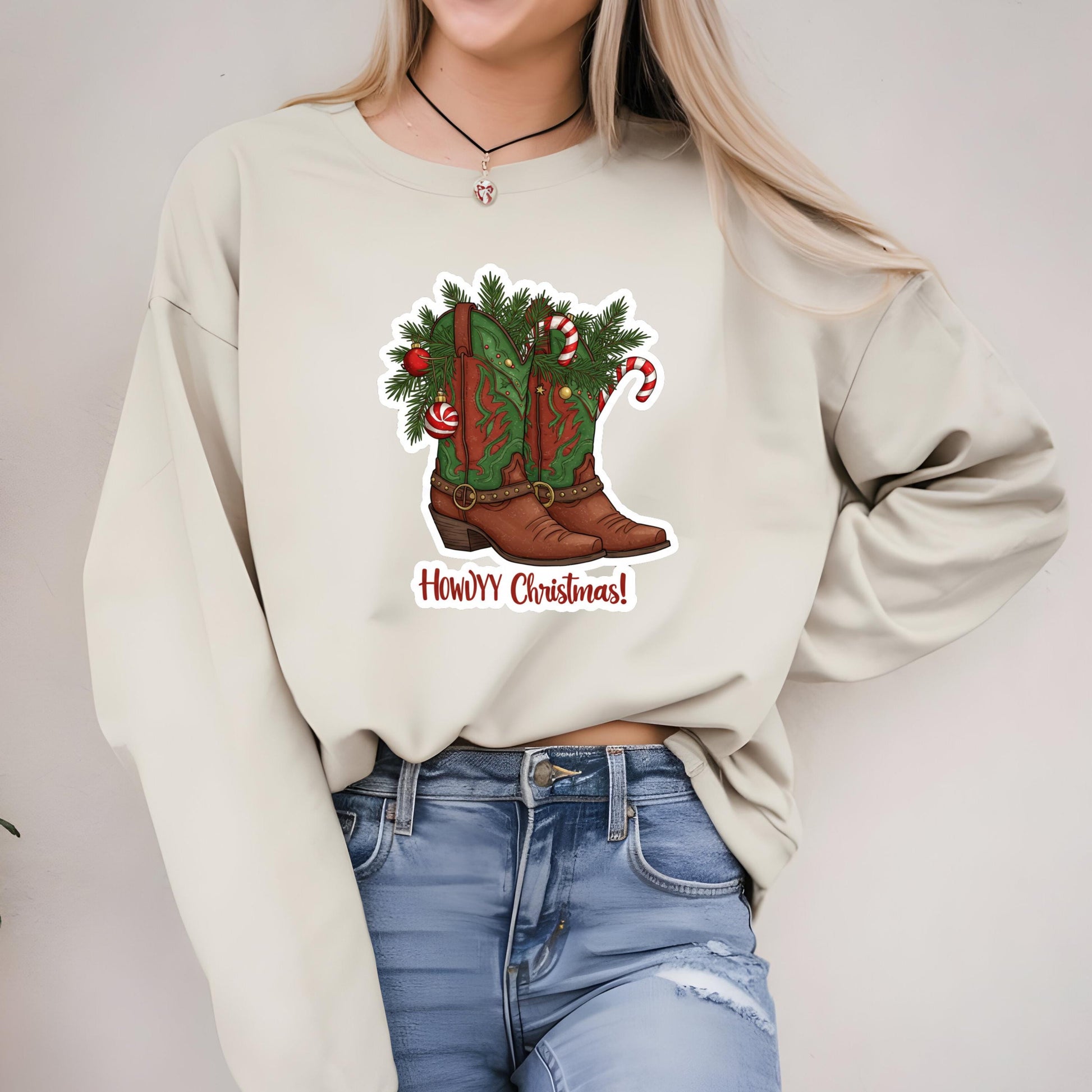 A woman wearing a white sweater with a graphic of a Christmas-themed boot on it.