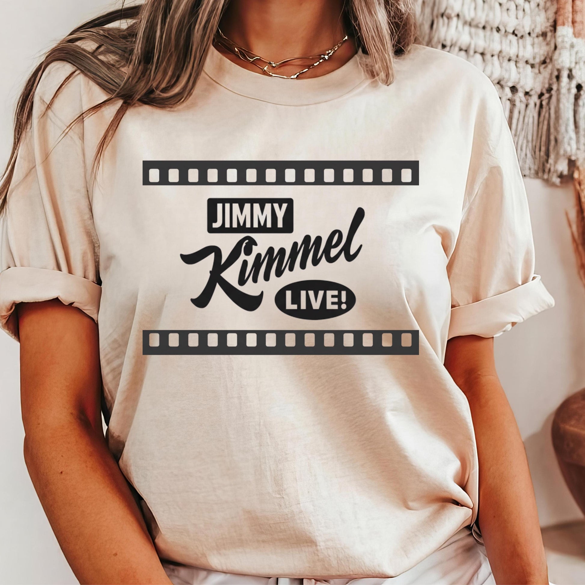 A person wearing a white t-shirt with the text &quot;JIMMY KIMMEL LIVE!&quot; printed on it.