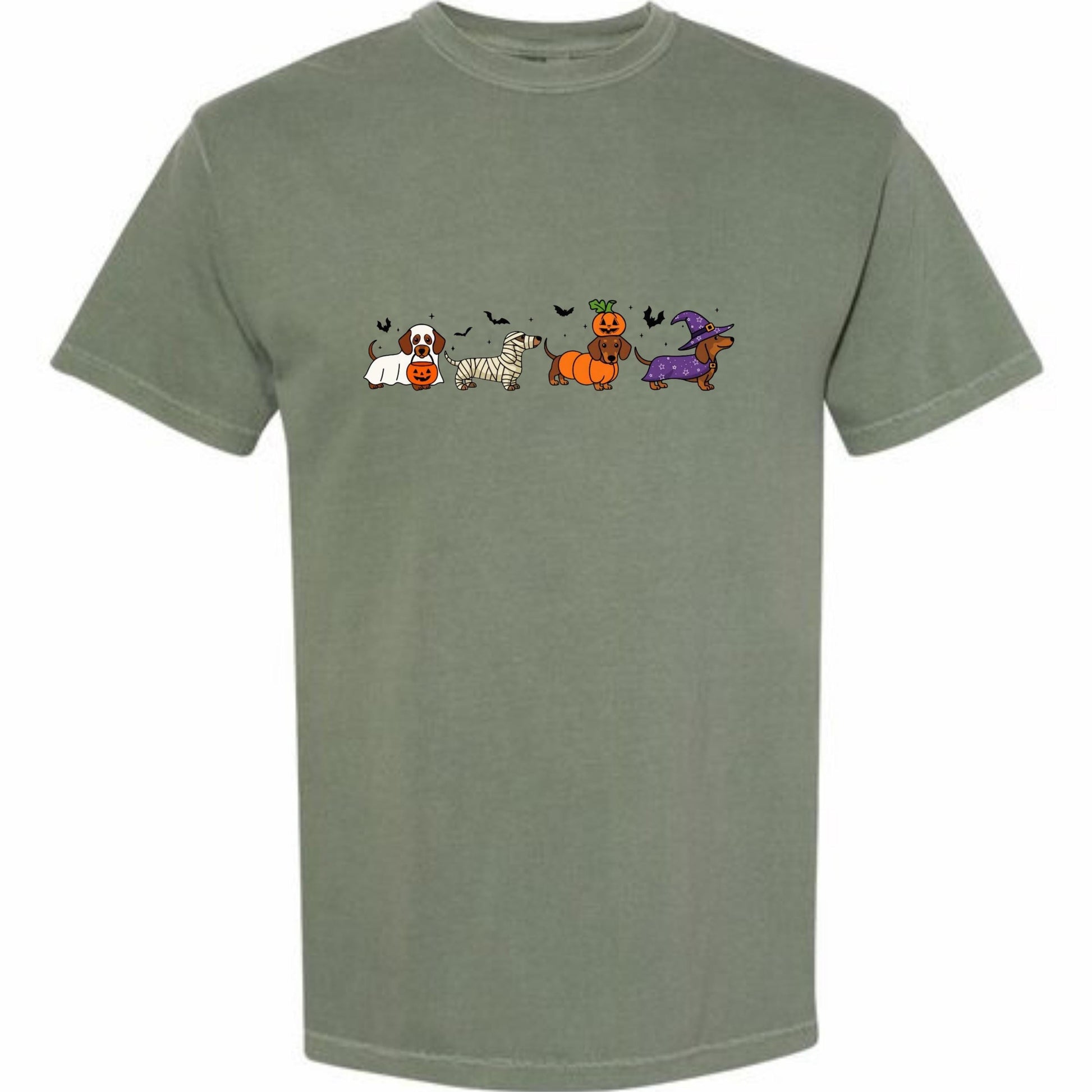A t-shirt with a graphic design featuring a line of cartoon dogs dressed in Halloween costumes, including a pumpkin, a witch&#39;s hat, and a ghost.