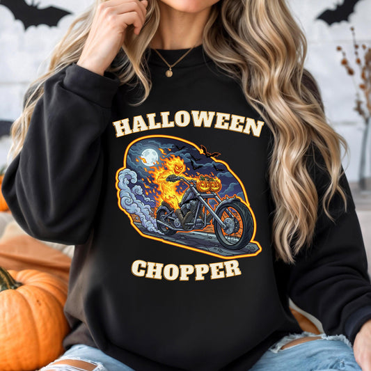 A woman wearing a black sweatshirt with a Halloween-themed graphic of a motorcycle and a jack-o-lantern on the front.