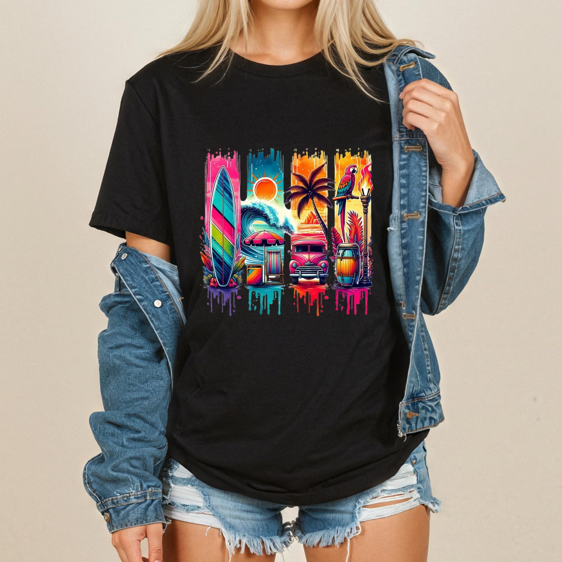 A woman wearing a black t-shirt with a colorful graphic design featuring a surfboard, palm trees, and other tropical elements.
