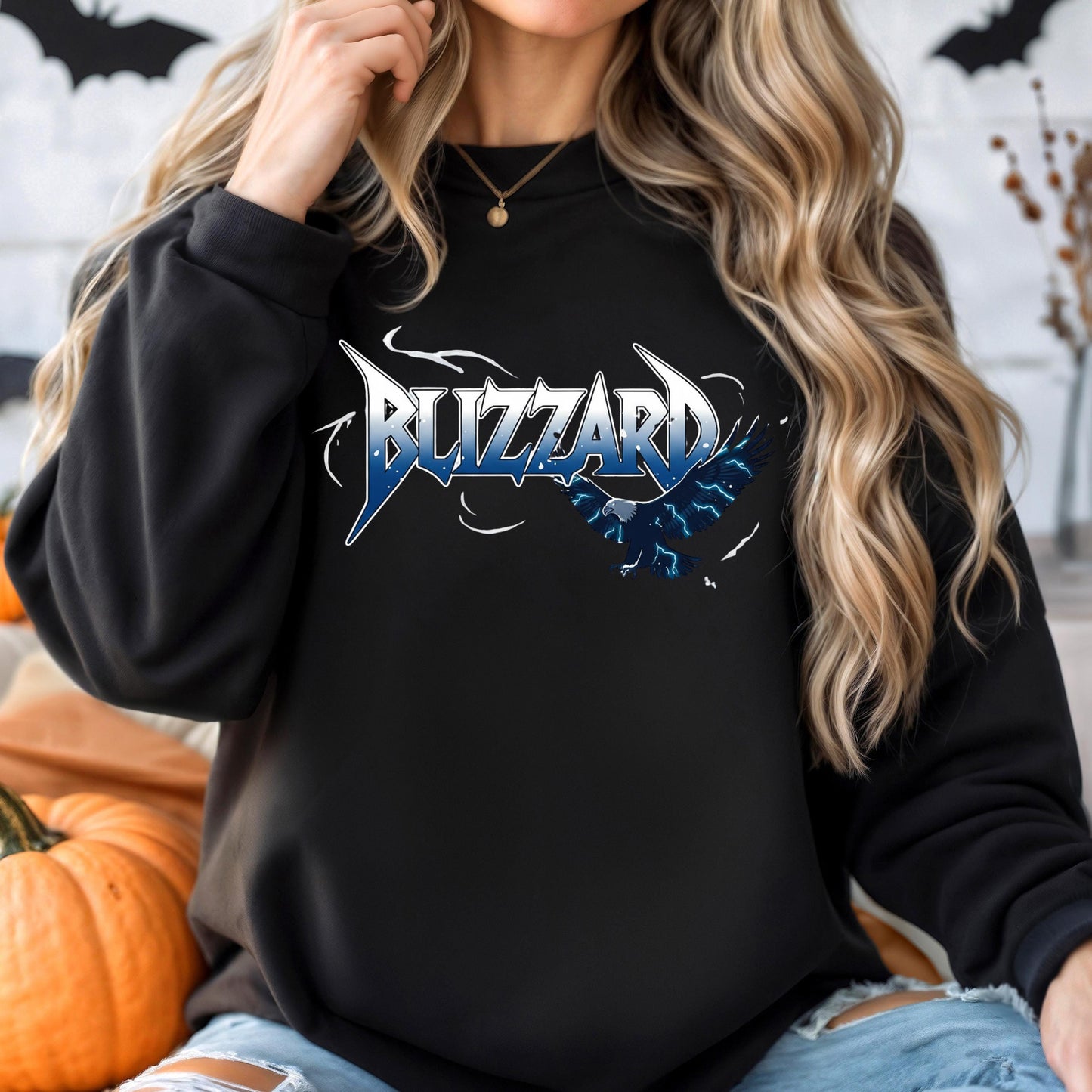 A woman wearing a black sweatshirt with the word &quot;BUZZARD&quot; printed on it.